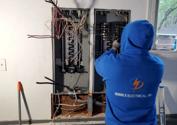 Dibble Electrical technician replacing an outdated residential electrical panel in Central Virginia